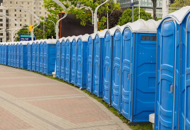 a row of portable restrooms at a fairground, offering visitors a clean and hassle-free experience in keene
